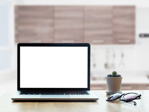 Modern Computer,laptop With Blank Screen On Table With Blur Modern Kitchen Backgrounds