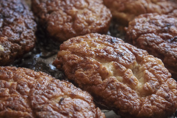 process of frying juicy home-made cutlets