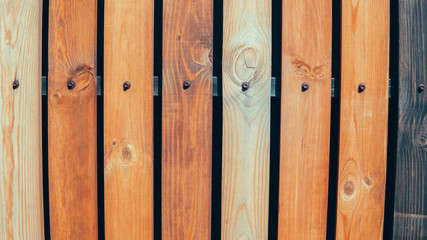Multicolored wooden wall and blue sky. A colored wall of wood with a lot of copy space. Wooden...