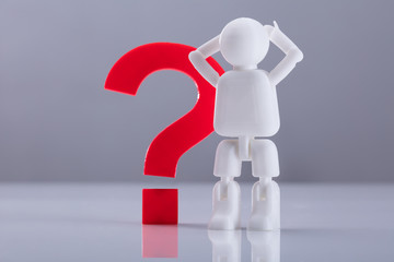 Human Figure Standing Beside Question Mark Sign