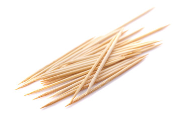 Toothpicks scattered. Close up. Isolated on white background.