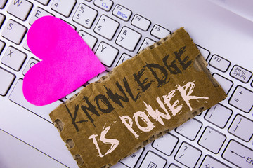 Word writing text Knowledge Is Power. Business concept for learning will give you advantage over others written on Tear Cardboard Piece placed on the Laptop Pink Heart next to it.