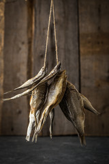Dried fish on old boards.  Food background