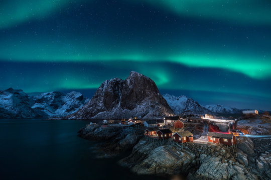 Fisherman village with Aurora in the background / travel concept world explore northern light
