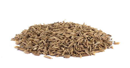 Cumin seeds or caraway isolated on white background