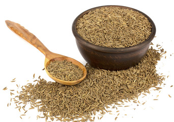 Cumin seeds or caraway isolated on white background. Cumin in spoon.