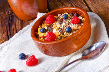 rustic muesli breakfast with forest fruits