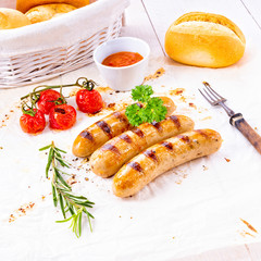 delicious bratwurst with ketchup and fresh rolls