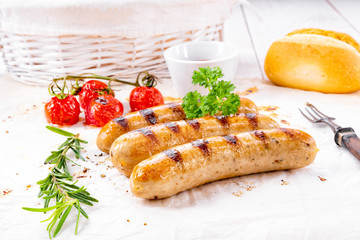 delicious bratwurst with ketchup and fresh rolls