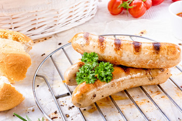 delicious bratwurst with ketchup and fresh rolls