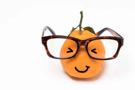 smiley orange wearing the eyeglasses on white backgrounds. cartoon emotion face orange isolated
