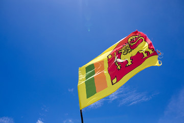 Flag of Sri Lanka against the sky.