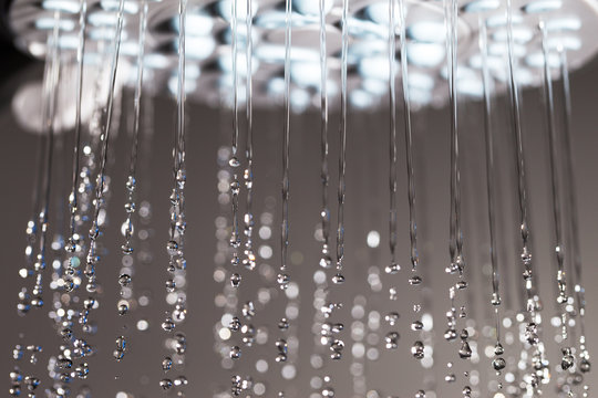 Shower head and falling water. © Janis Smits