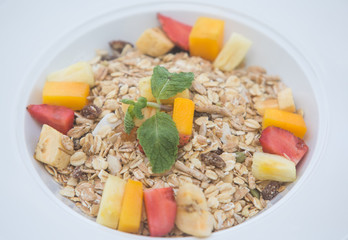 Cereals with fruits in plate healthy breakfast concept