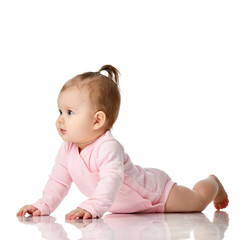 8 month infant child baby girl toddler lying in white shirt looking up 