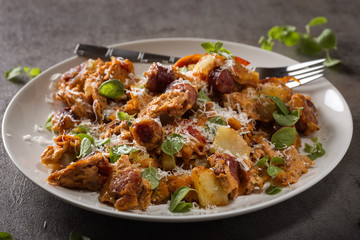 Omelette made from eggs, potatoes, sausages and cheese