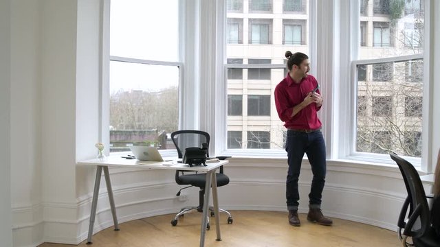 Man and a woman working in an office