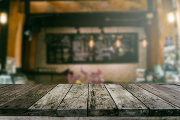 Wood shelf with coffee shop blurred background
