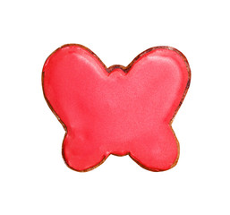 Gingerbread in the form of a butterfly with red glaze. Isolated on white.