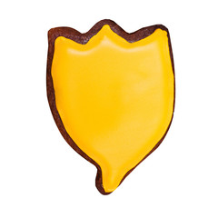 Gingerbread in the form of a flower with yellow glaze. Isolated on white.