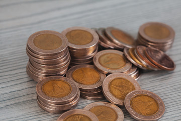 Stacking money coins on wood background, the saving with growing up your money.