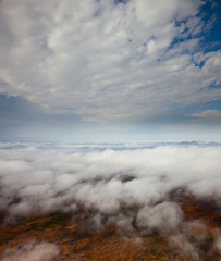 Flight between the clouds