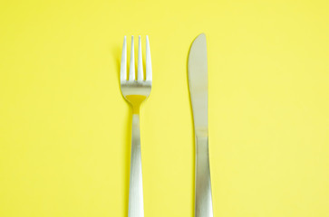 a knife and a fork.  ナイフとフォーク　黄色背景