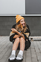 Girl sits on longboard