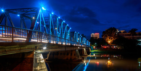 Romantic Sapaan Bridge spans over the Ping River in Chiang Mai, Thailand at night