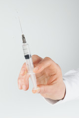 Medicine. Vaccination. Disposable syringe with medicine in women's hand