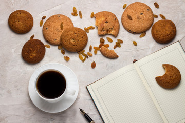 Cup with Black Coffee, Cookies, Diary and Pen on the Light Background