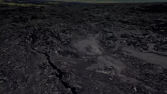 Flying over frozen lava of Big Island of Hawaii, USA