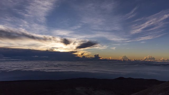 Sunrise cloudscape time lapse over the summit of Mauna Kea landscape of Big Island of Hawaii, USA