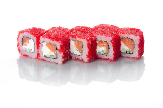 On white background isolated with reflection, sushi rolls red with caviar with eel and salmon with Japanese mayonnaise droplets