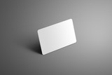 Realistic white mockup one  bank (gift) card with shadows on a gray background.