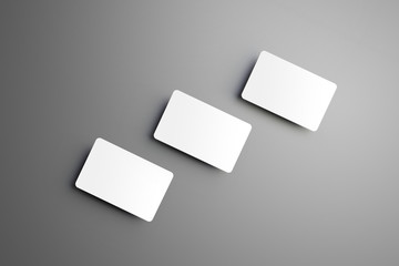 Realistic mockup of three  bank (gift) card isolated on a gray background.
