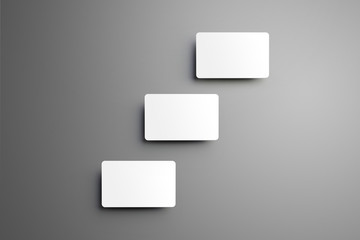 Concept business mockup of the three  bank gift cards with shadows  on a background.