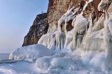 Fototapeta na wymiar Russia. Lake Baikal. Iced rocks in the winter season