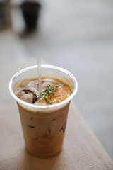 Iced Coffee latte with orange mix in close up