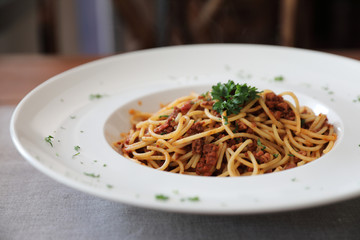 Spaghetti bolognese with beef tometo sauce on wood table , italian food