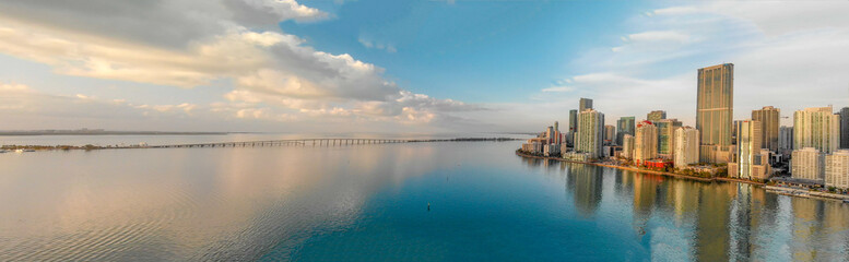 Panoramic aerial view of Miami and ocean at sunrise - obrazy, fototapety, plakaty