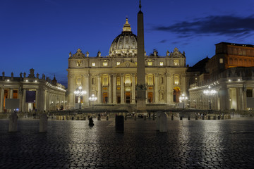 Vatican City, Rome Italy Piazza San Pietro night view. St. Peter’s square with illuminated facade view of Basilica and Apostolic Palace - Palazzo Apostolico, Pope’s official residence.