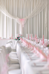 a festive table with plates, cutlery, and cups