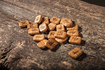 Runes on a textured old wooden surface