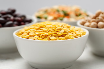 Mix of different beans in ceramic bowl, macro
