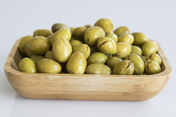 olive on the wooden plate.Eat olive oil for a healthy life.