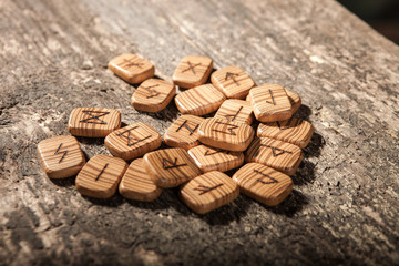 Runes on a textured old wooden surface