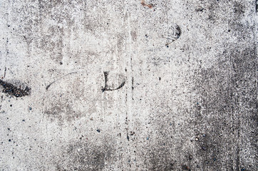 Texture background of gray concrete with footprints of shoes.