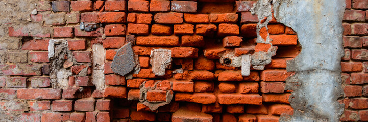 panorama of broken orange brick wall