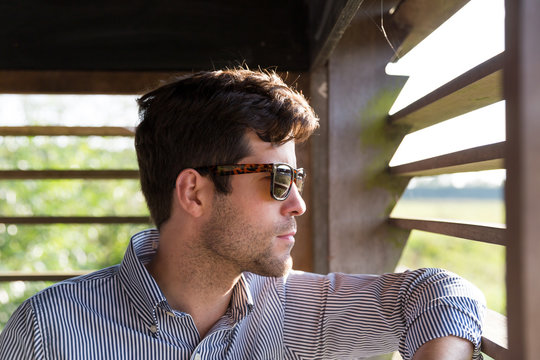 Man looking out into nature from observation post